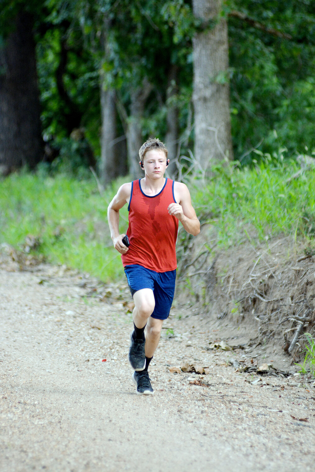 Jackson Kilmer runs along a gravel road in Maries County during Vienna’s Cross Country camp held last week prior to this week’s MSHSAA mandated dead week.